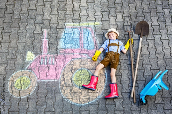 Fototapeta little kid boy having fun with tractor chalks picture