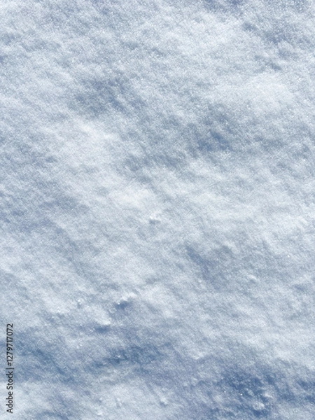 Fototapeta Natural fresh snow texture close up, surface of snow crust in sunny day. Snowy background, winter backdrop