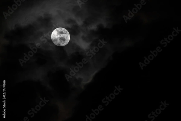 Fototapeta Moon and clouds in the sky.