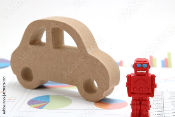 Obraz ロボットと車のミニチュアとグラフのビジネスコンセプト
