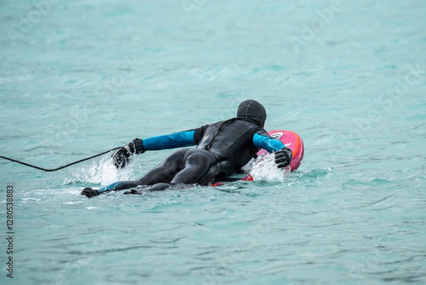 Fototapeta Wingfoil is a sport combining kitesurfing and windsurfing. Moment of getting into the water. Wing foil is a dynamically developing sport for everyone