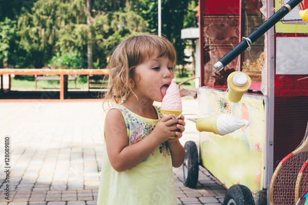 Obraz Little girl playing with a toy ice cream.