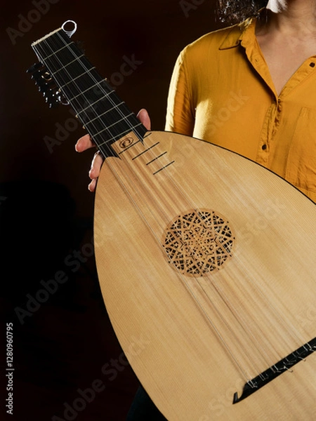 Obraz Woman holding a lute instrument