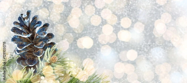Obraz Pinecones and fir tree on sparkling background.