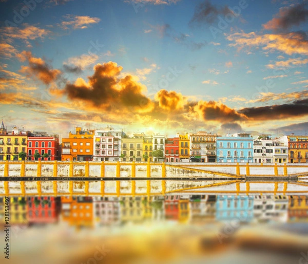 Fototapeta Magnificent Colorful panorama of Seville riverside of Guadalquivir at sunset, Spain