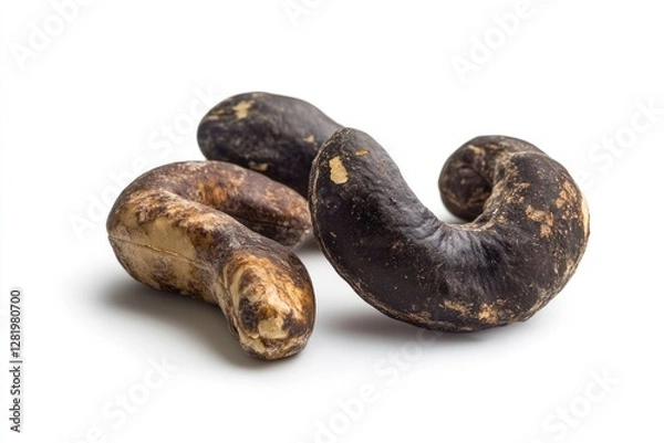 Fototapeta Three roasted cashew nuts displayed on white background