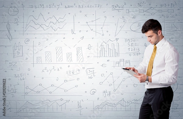 Fototapeta Salesman standing with drawn graph charts