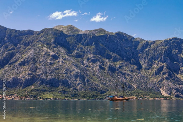 Fototapeta Amazing landscape view of the mountains and the sea and sailing yacht
