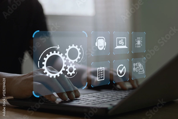 Fototapeta Robotic Process Automation (RPA) technology to automate business tasks with AI.  Digital transformation and change management. Concept with engineer setting up automated software on a laptop computer.