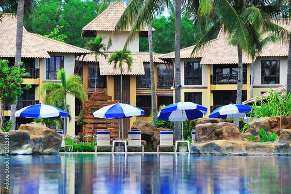 Obraz deck chairs along the pool side