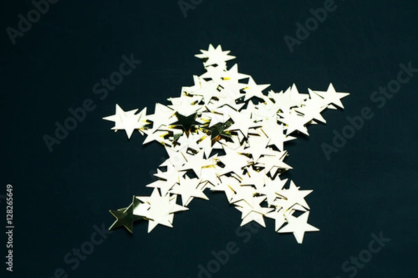 Obraz Star of sequins on a black background