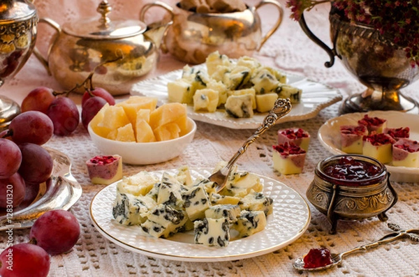 Fototapeta Roquefort cheese on a plate. A beautiful table setting.