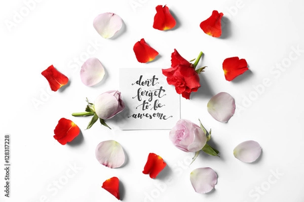Fototapeta Quote "Dont forget to be awesome" written on paper with petals and flowers. Top view