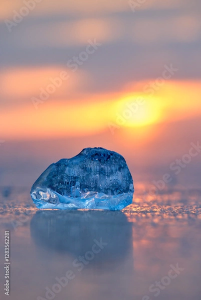 Fototapeta Transparent ice floe on the background of sunset on Lake Baikal