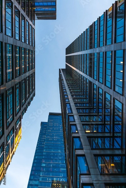 Fototapeta Skyscrapers in Warsaw. Office buildings in the business part of the city. Glass and steel structures. Center of Warsaw	