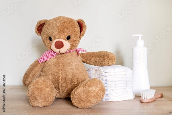 Fototapeta Stack of diapers with toy teddy bear on table.Newborn nappies concept