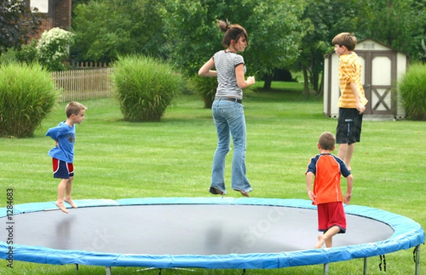 Obraz kids jumping on trampoline