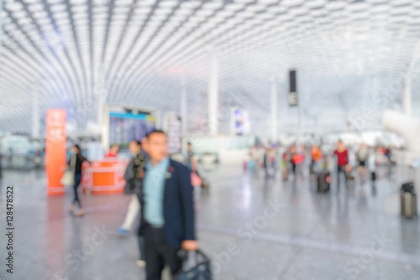 Fototapeta people walking in a busy airport in Shenzhen,China.