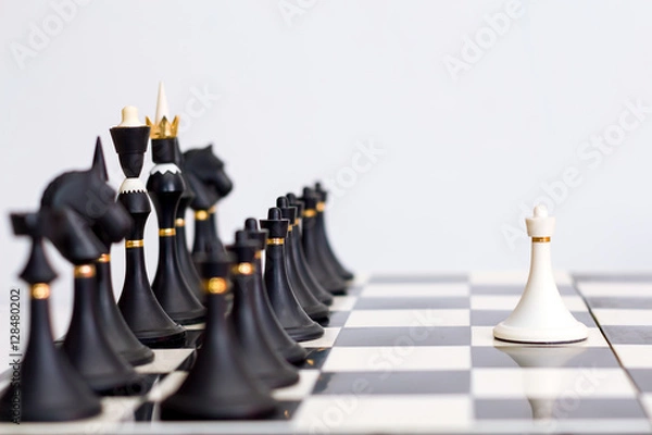 Obraz chess white pawn in front of black pieces