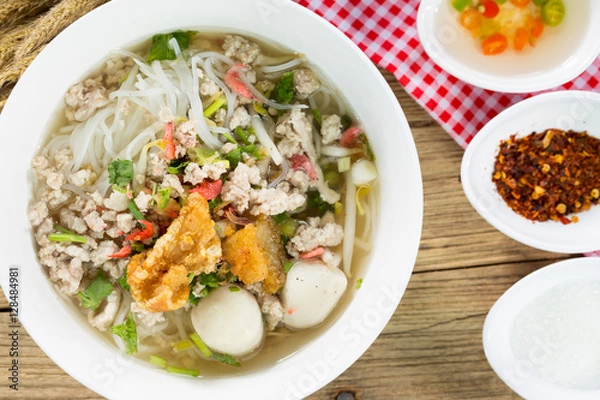 Fototapeta Thin rice noodles with sliced Pork in broth, Thai noodle