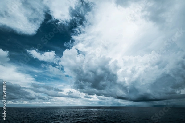 Fototapeta Dark clouds in open ocean