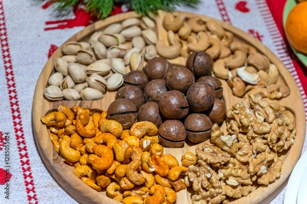 Fototapeta Various types of nuts are on a plate