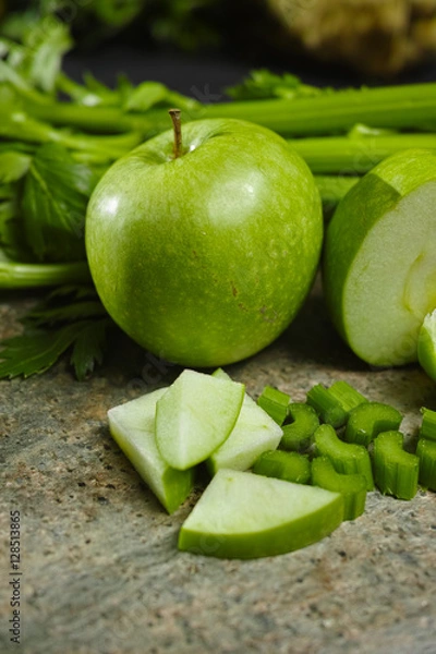 Fototapeta Green vegetables and fruits -  celery shoots and  apples, dietary fitness concept
