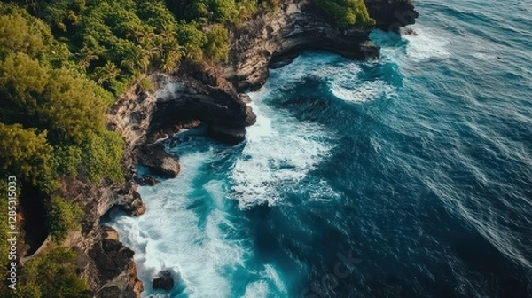 Fototapeta Aerial View of Lush Cliffs and Waves on a Serene Bali Coastline at Sunset