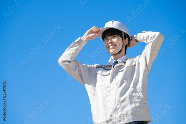 Fototapeta 作業着を着た男性