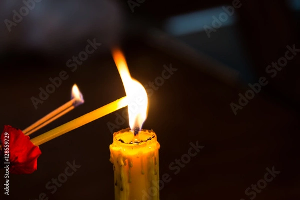 Obraz Candle light,Red Flower on black background