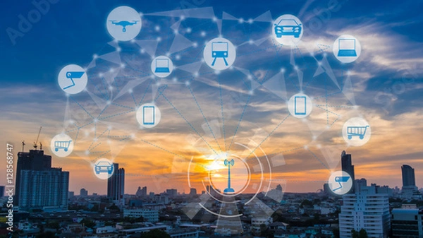 Obraz Internet of Things and Smart city concept. Smart things icons mesh on city traffic at twilight background.