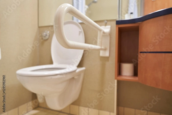 Fototapeta Close-up of the toilet handrails. A public toilet for people with disabilities. Special plastic handrails in the bathroom. With space to copy. High quality photo