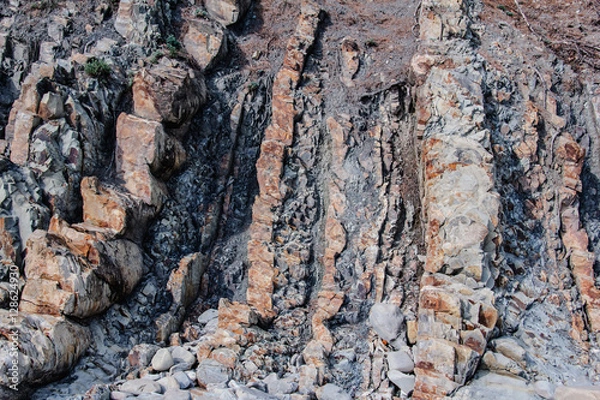 Obraz Rock face with cracks and fissures