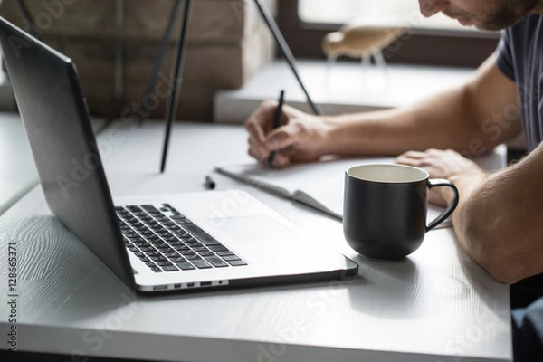 Fototapeta Guy is using laptop