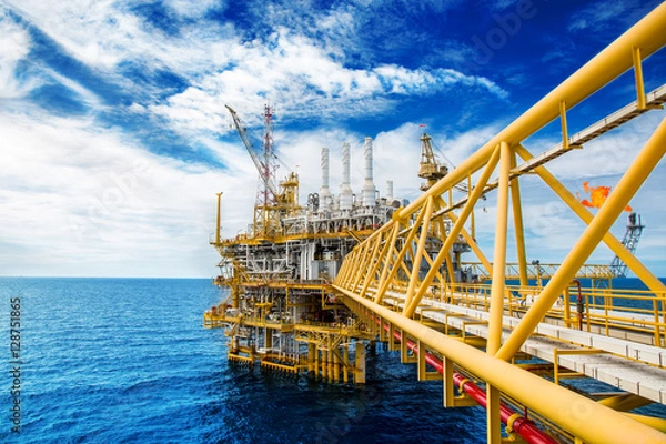 Obraz Oil and gas platform or Construction platform. power business concept. offshore rig plant. energy concept. stock investment