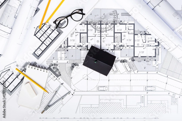 Fototapeta Construction plans with drawing Tools and House Miniature on blu