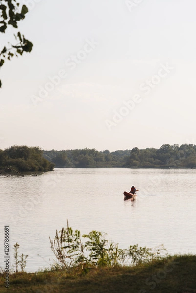 Obraz Person kayaking on a tranquil lake