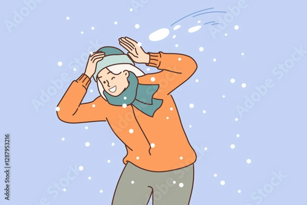 Obraz Happy woman plays snowball and dodges snow flying at head, rejoicing in arrival of winter days