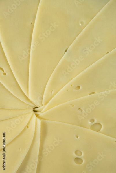 Fototapeta Semi-hard cheese close-up, thin slices, top view