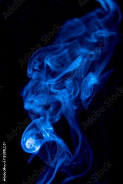 Fototapeta blue smoke on black background