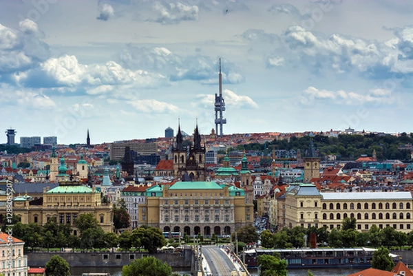 Fototapeta View of the Vltava River, Manesov Bridge and the old part of Prague with the towers of the Tyn Church, in the Czech Republic from the Wallenstein Garden.