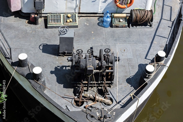 Fototapeta Top view of the deck of a river boat with rigging, ropes and chains.