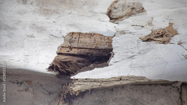Fototapeta The collapsed ceiling of an old house.
