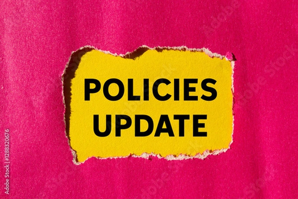 Fototapeta Policies update message written on ripped torn pink paper on yellow background. Conceptual policies update symbol. Copy space.