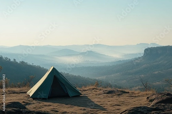 Fototapeta Small tent on a hilltop offers stunning views of distant mountains and valleys during early morning light. Generative AI