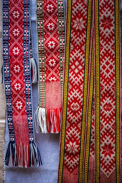 Fototapeta Handmade ethnographic garter with a pattern