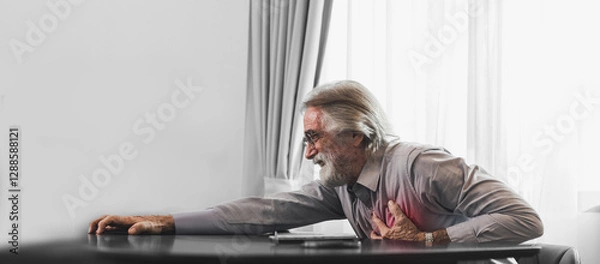 Obraz Senior man in spectacles presses hand to chest has heart attack suffers from unbearable chest pain closes eyes wears glasses sitting in front of laptop. People age and problems with health.