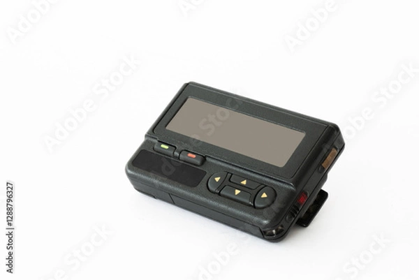 Obraz Vintage pager lying on a white surface showcasing retro technology and communication history