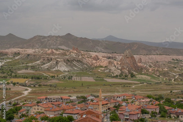 Fototapeta Cappadocia’s colorful rock formations, shaped by wind and water erosion, create a surreal landscape. Layers of volcanic rock reveal history, while valleys and cliffs form an awe-inspiring natural wond