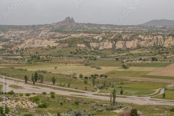 Fototapeta Cappadocia’s colorful rock formations, shaped by wind and water erosion, create a surreal landscape. Layers of volcanic rock reveal history, while valleys and cliffs form an awe-inspiring natural wond